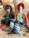 Vintage Mexican and Handmade Hippie Puppet Marionette Toys on Burlap Background