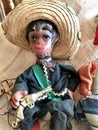 Vintage Mexican Puppet Marionette Toys on Burlap Background