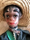 Vintage Mexican Puppet Marionette Toys on Burlap Background