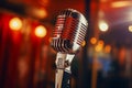 Vintage microphone on blurred night club background. Invitation to a stand-up evening, concert or open mic show. Copy Royalty Free Stock Photo