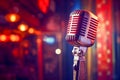 Vintage microphone on blurred night club background. Invitation to a stand-up evening, concert or open mic show. Copy Royalty Free Stock Photo