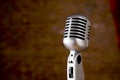 Vintage Microphone in front of blurred background Royalty Free Stock Photo