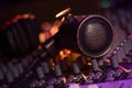 Vintage Microphone and Headphones on dirty sound mixer panel Royalty Free Stock Photo