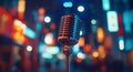Vintage microphone illuminated by colorful city lights at night