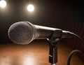Vintage Microphone Illuminated by a Warm Spotlight on Stage Royalty Free Stock Photo