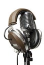 Vintage Microphone with modern headphones Royalty Free Stock Photo