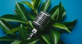 Vintage Microphone Nestled Amongst Lush Green Leaves Royalty Free Stock Photo