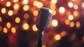 A vintage microphone stands ready for a performance, glowing in warm lights Royalty Free Stock Photo