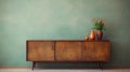 Vintage mid-century cabinet near beige grunge stucco wall. Interior design of living room