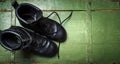 Vintage military boots on a old ammunition box Royalty Free Stock Photo