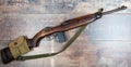 Vintage military m1 carbine rifle, with a two clip pouch on the stock