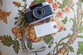 Vintage 35mm antique camera on a floral design table