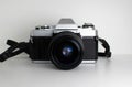 Vintage 35mm film analogue SLR camera on white background Royalty Free Stock Photo