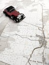 Vintage model car and map Royalty Free Stock Photo