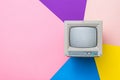 Vintage monitor with a kinescope on a multicolored background. Vintage electronics. Royalty Free Stock Photo