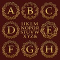 Vintage monogram kit. Golden letters and floral round frames for creating initial logo in antique style Royalty Free Stock Photo