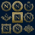 Vintage monograms set of N letter. Golden heraldic logos in wreaths, round and square frames