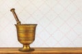 Vintage mortar on an old wooden table Royalty Free Stock Photo