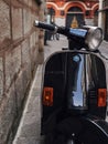 Vintage motor scooter on the streets of spain on a sunny summer day