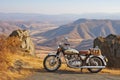 vintage motorbike parked at a scenic viewpoint overlooking a valley