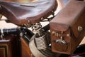 Vintage motorcycle leather saddle and toolbox