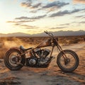 A vintage motorcycle parked on a desert road at sunset, showcasing rugged beauty and a sense of freedom