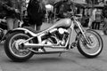 Vintage motorcycle customised chopper on the street black and white.