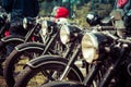 Vintage motorcycles stand in a row Royalty Free Stock Photo