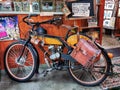 Vintage motorised bicycle at shop's entrance in Oamaru Royalty Free Stock Photo