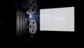 Vintage movie projector and blank screen