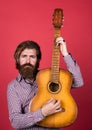 Vintage music shop. bearded man being a rock star. casual male guitarist. concept of music and vocal. man playing the Royalty Free Stock Photo