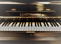 Old black French piano L.Delvain, Paris, keyboard, logo, musicstand Royalty Free Stock Photo