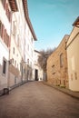 Vintage narrow street with old brick houses in Florence, Italy. Architecture and landmark of Florence. Cozy Florence Royalty Free Stock Photo