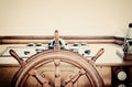 Vintage nautical detail of a ship`s old wooden wheel Royalty Free Stock Photo