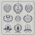 Vintage nautical wreath labels set on light wood background