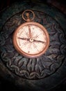 Antique compass on a wooden table Royalty Free Stock Photo