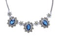 Vintage necklace with blue gems on a white background Royalty Free Stock Photo