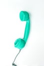 Vintage neo green mint color phone handset on white background. Royalty Free Stock Photo