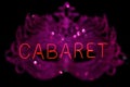 Vintage Neon Cabaret Sign With Bokeh Carnival Mask in Window Royalty Free Stock Photo