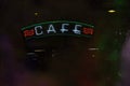 Vintage Neon Cafe Sign on Small Town Restaurant at Night Royalty Free Stock Photo