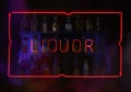 Vintage Neon Liquor Sign in Wet Window Royalty Free Stock Photo