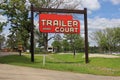 Vintage Neon Trailer Court Sign at RV Park Near Lake