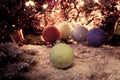 Vintage new year, Christmas background with multi color Christmas decorations on snow