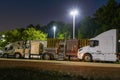 Vintage Night Halt: Classic Semis Under Blue Sky