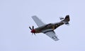 Vintage North American P-51 Mustang aircraft in flight.