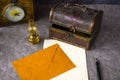 Vintage objects on the table, old box, lamp, clock, envelope, and pen