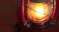 Vintage oil lamp antique stands on the table in the dark. Royalty Free Stock Photo