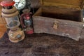 Vintage oil lamp ,old wooden box  and alarm clock on old wooden touch-up in still life concept Royalty Free Stock Photo