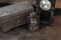 Vintage oil lamp ,old wooden box and alarm clock on old wooden touch-up in still life concept Royalty Free Stock Photo