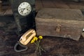 Vintage oil lamp ,old wooden box, old telephone , dry chrysanthemum flower and alarm clock on old wooden touch-up in still life Royalty Free Stock Photo